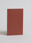 Plyco's 0.6mm Dark Orange Laminate on a white background