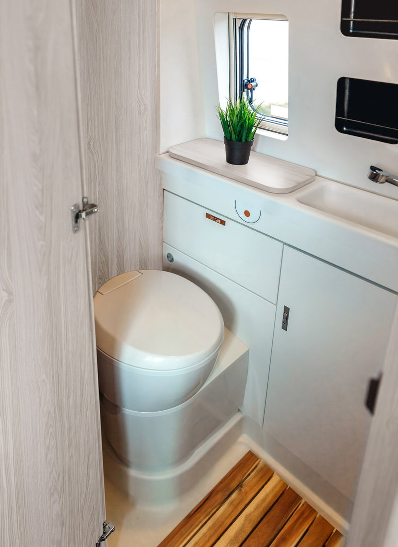 Bathroom in a RV / Caravan featuring 3mm Grey Oak Vanply for interior caravan wall panels and cabinets from Melbourne plywood supplier Plyco without a white background