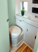 Bathroom in a RV / Caravan featuring 3mm Mint Vanply for interior caravan wall panels and cabinets from Melbourne plywood supplier Plyco without a white background