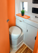 Bathroom in a RV / Caravan featuring 3mm Orange Vanply for interior caravan wall panels and cabinets from Melbourne plywood supplier Plyco without a white background