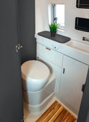 Bathroom in a RV / Caravan featuring 3mm Raven Vanply for interior caravan wall panels and cabinets from Melbourne plywood supplier Plyco without a white background