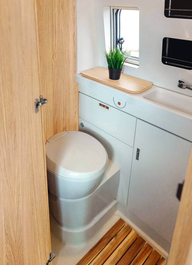 Bathroom in a RV / Caravan featuring 3mm White Oak Vanply for interior caravan wall panels and cabinets from Melbourne plywood supplier Plyco without a white background