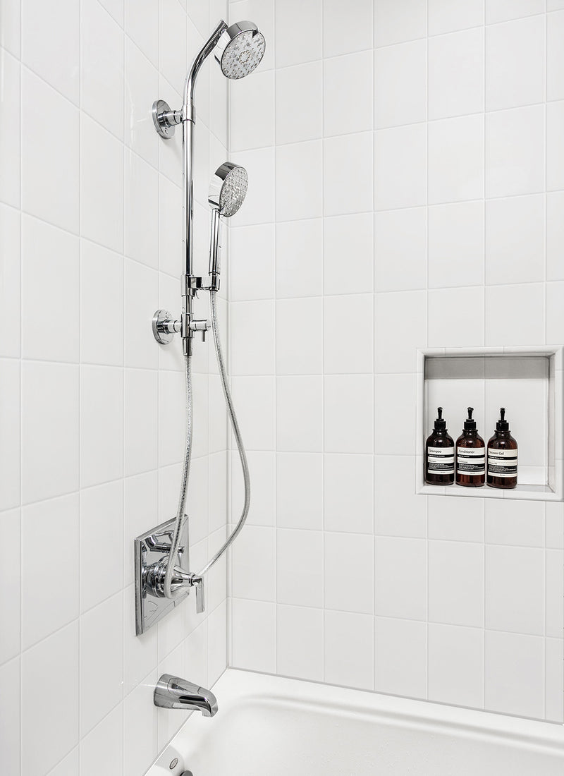 A residential shower featuring Forest One's Designer White Tiled WallART Wet Area Panel from Plyco without a white background